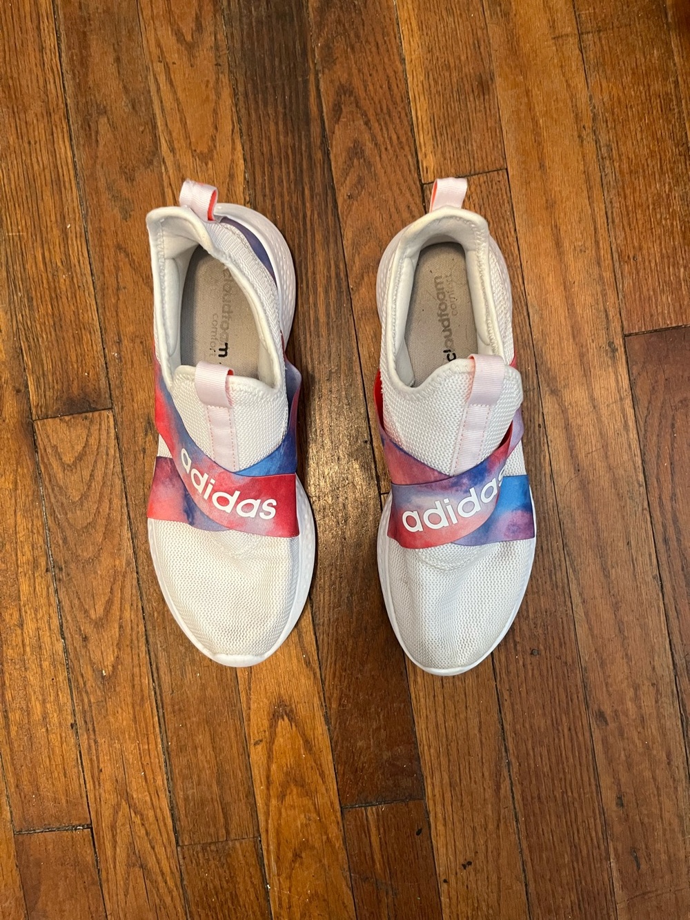 adidas women’s White Slip-On Sneakers with Pink & Blue Watercolor Strap